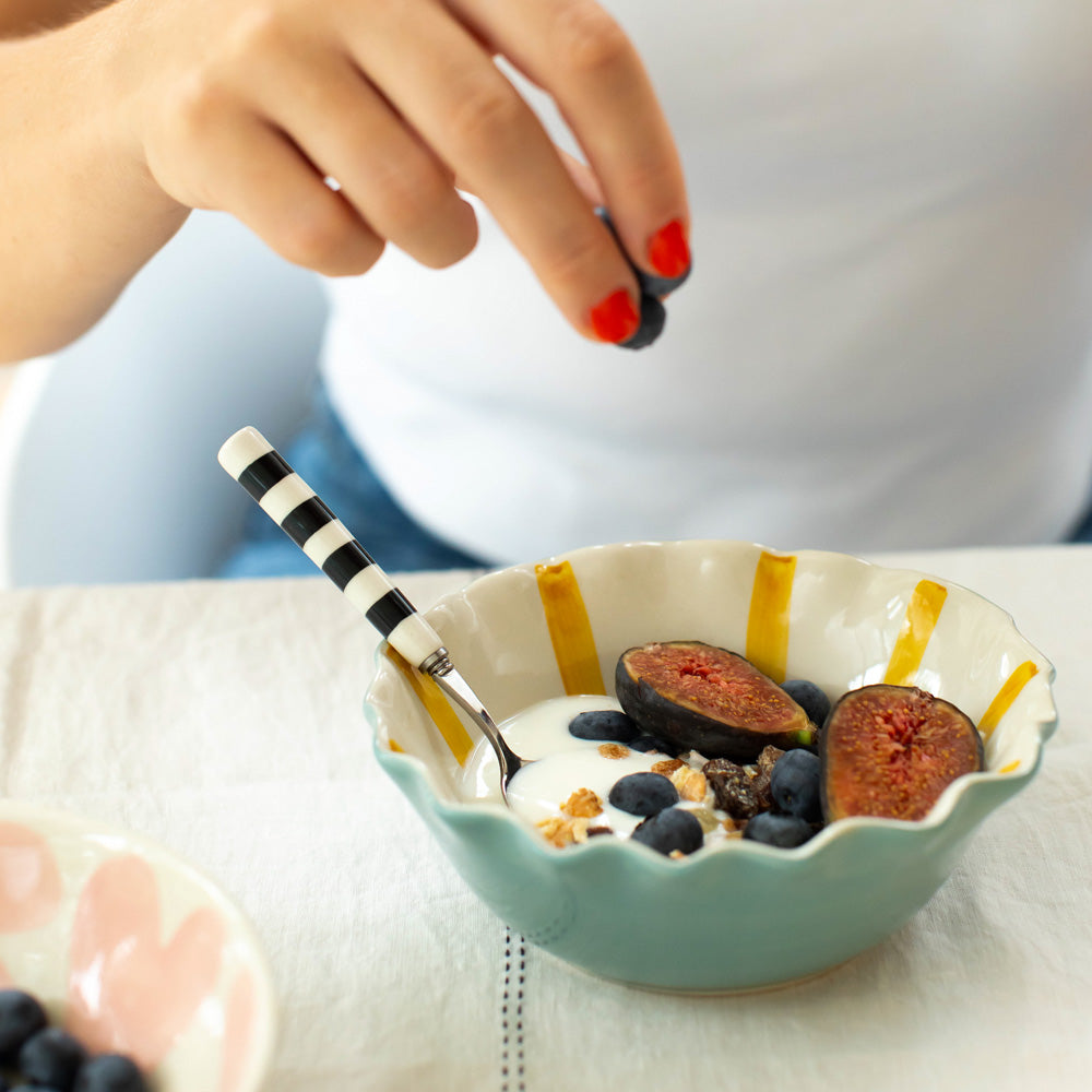 hand painted ceramic stoneware cereal bowl with baby blue outer, mustard stripe internal design and scalloped edges