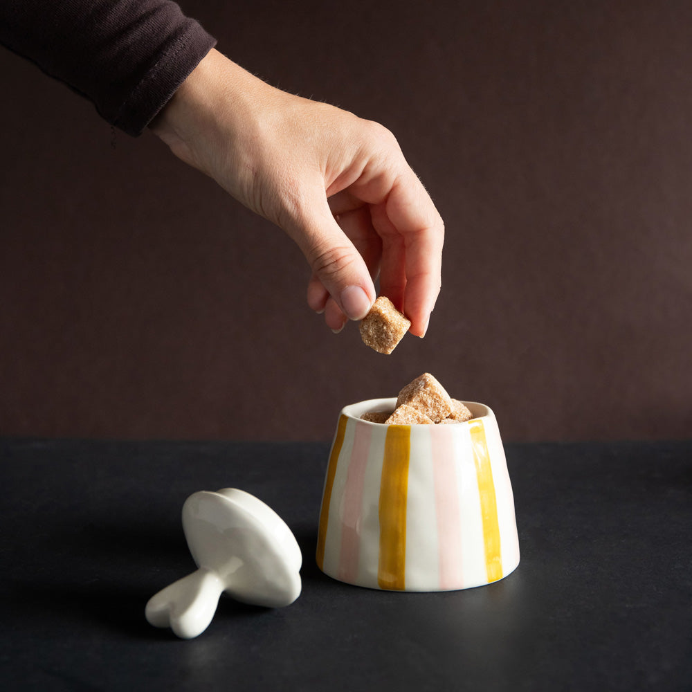 hand painted glazed ceramic stoneware sugar pot or trinket storage pot with a pink and mustard stripe design and heart shaped lid