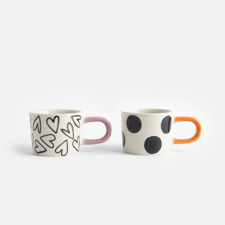 set of 2 hand painted stoneware espresso cups in spots and hearts designs
