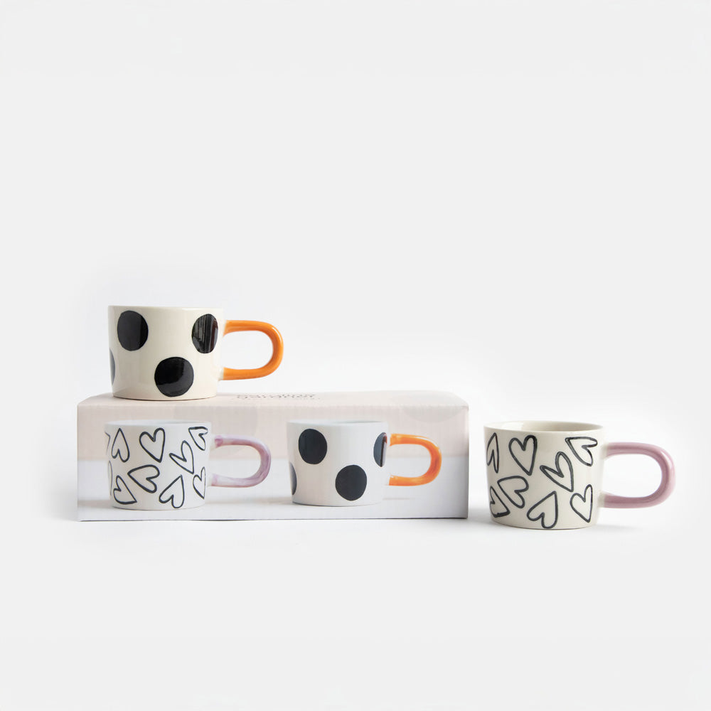 set of 2 hand painted stoneware espresso cups in spots and hearts designs with presentation box