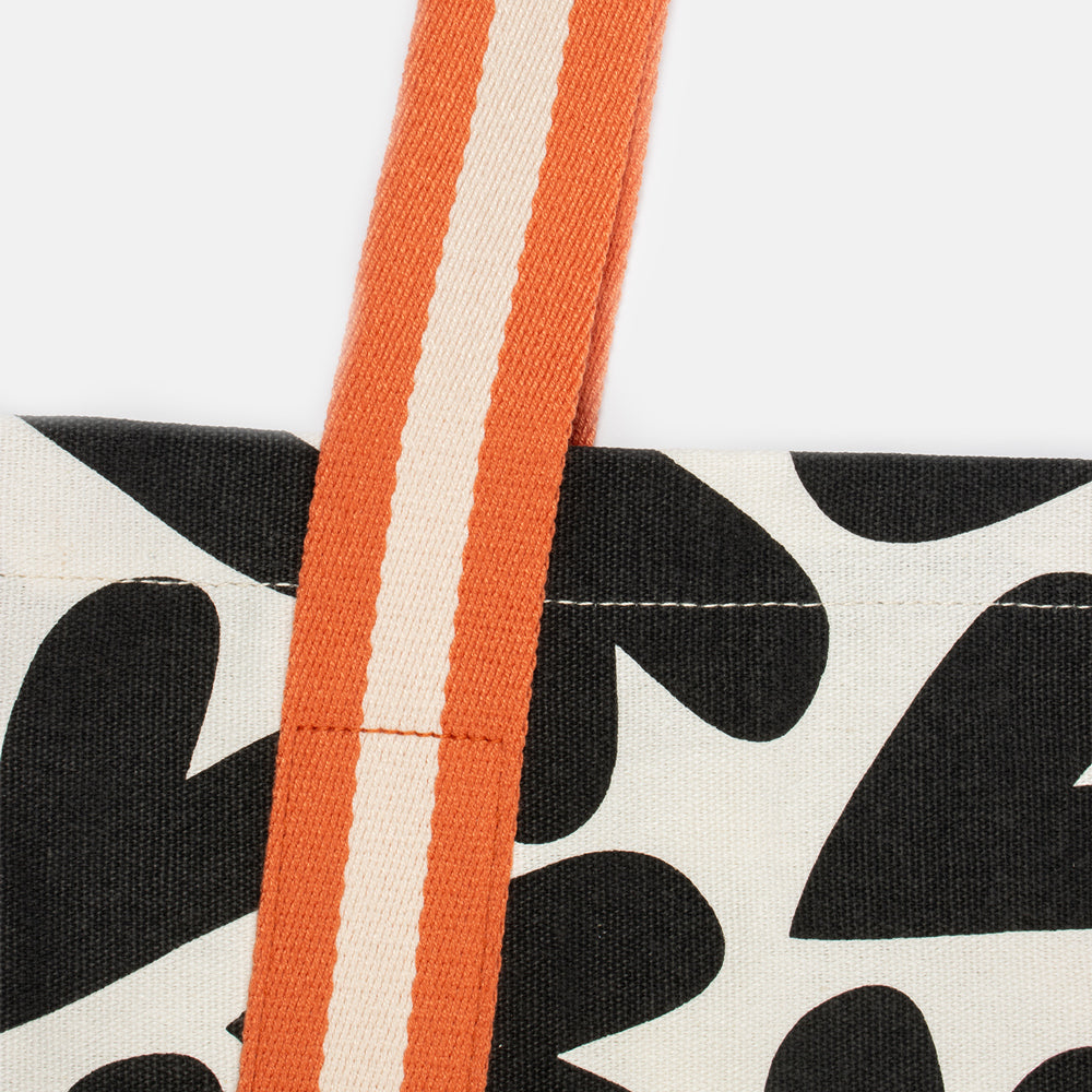 black and white monochrome hearts cotton canvas tote bag with contrast orange webbing straps