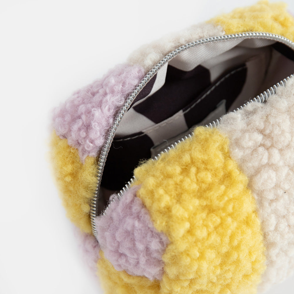 mini cube cosmetic bag in lilac, yellow  and cream borg with silver zip, monochrome grosgrain pull and monochrome striped lining
