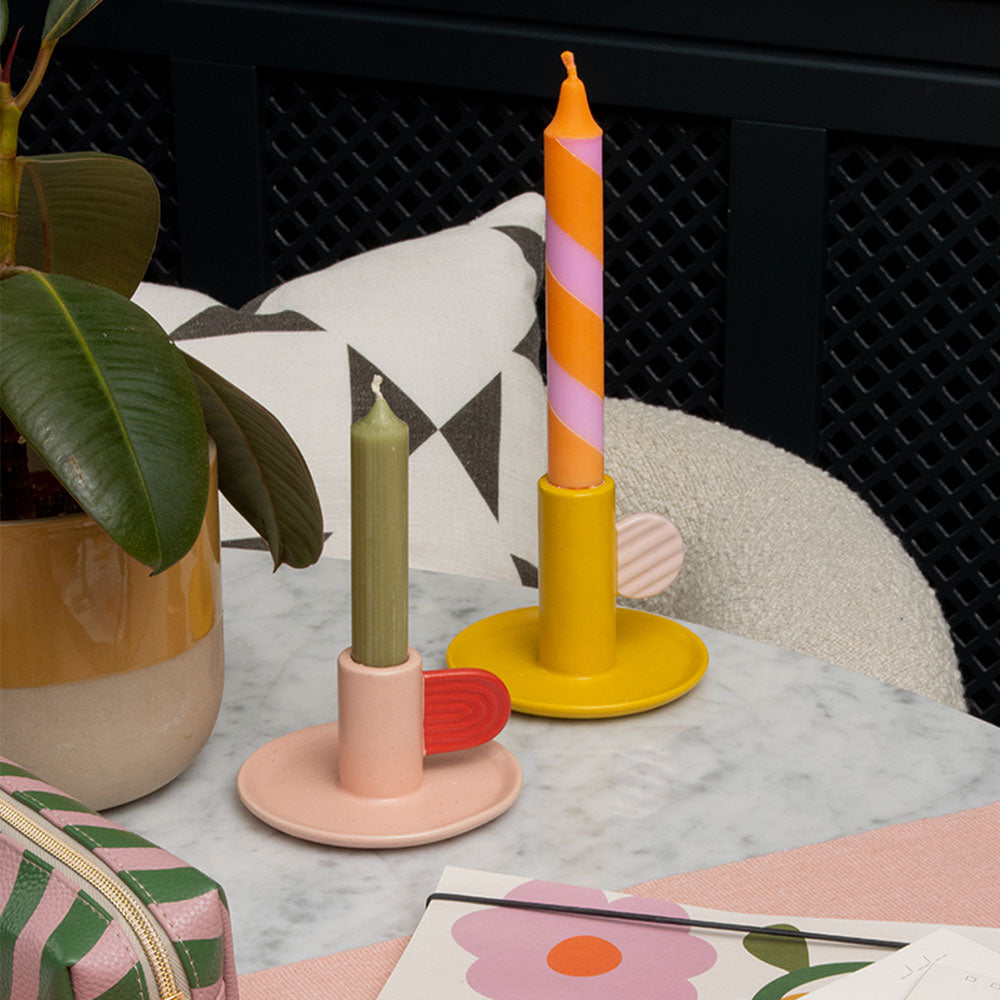 hand painted ceramic pale pink candle holder with red handle