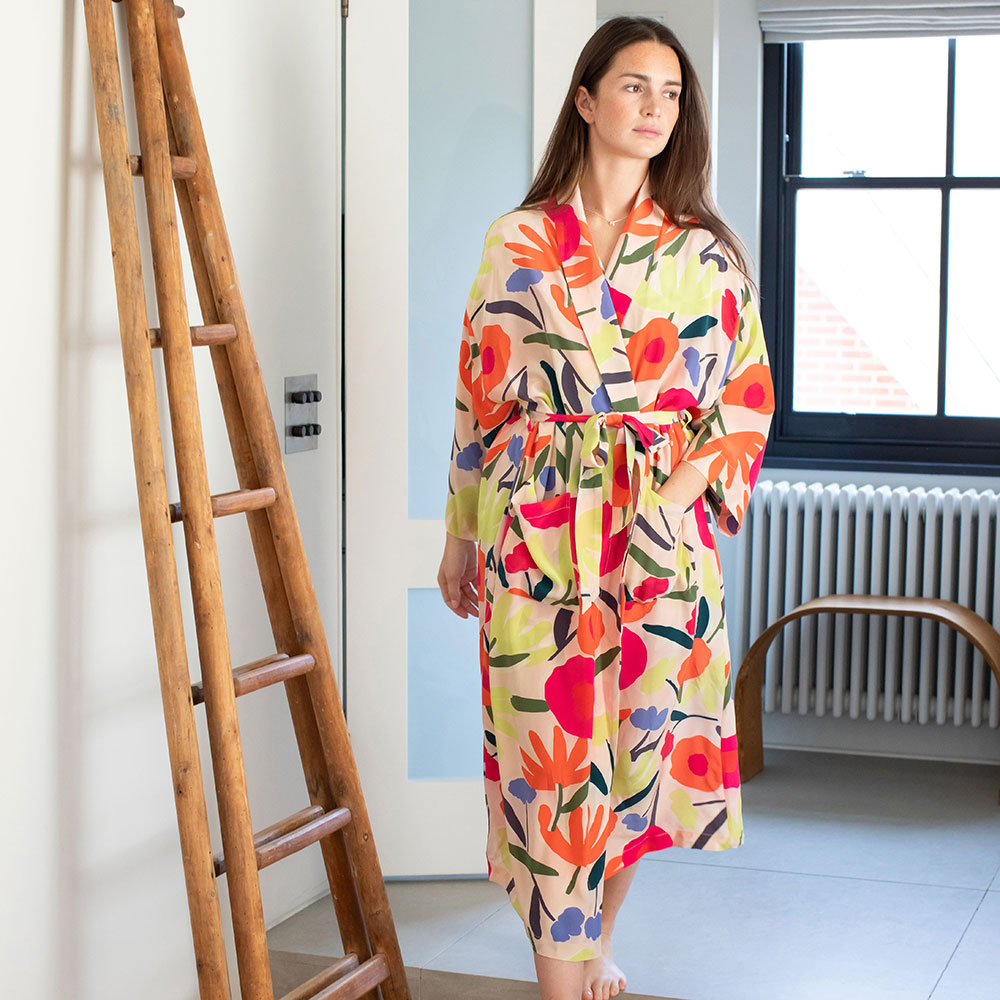 colourful abstract floral print silk dressing gown on a pale pink base