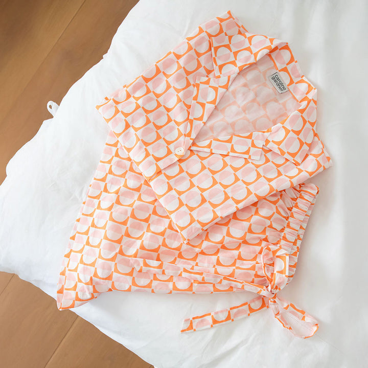 pastel pink & orange geometric circles print cotton pyjama set with shorts and revere collar short sleeved shirt