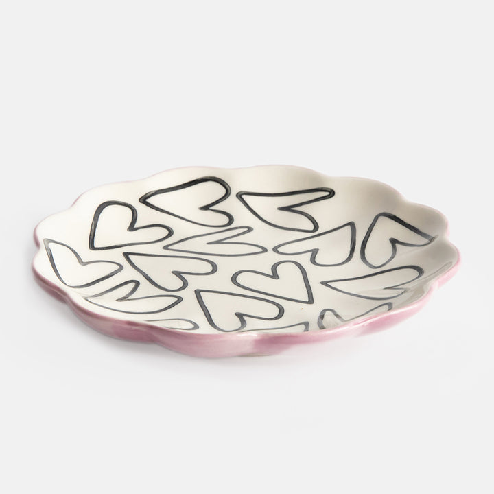 hand painted ceramic trinket dish with scalloped edges, mono heart outlines on the surface and soft pink bottom