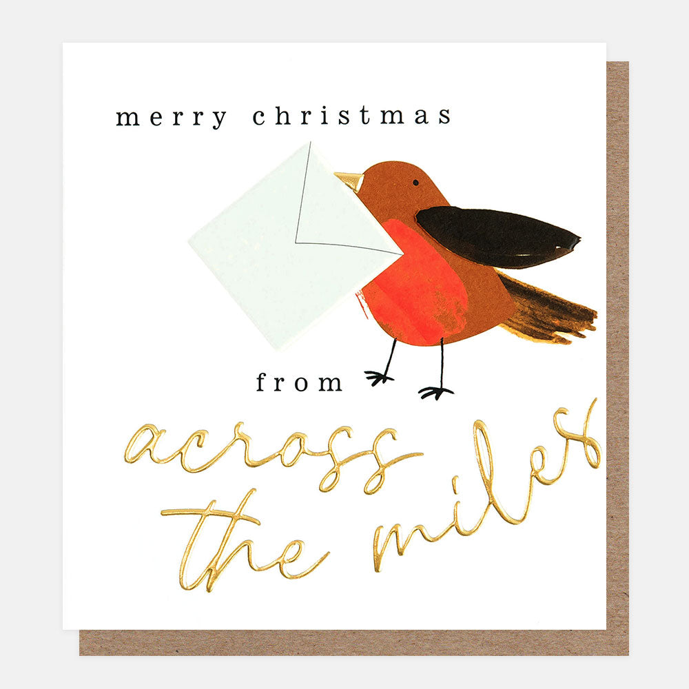 robin holding an envelope merry christmas from across the miles card