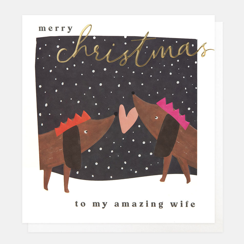 Christmas card featuring two sausage dogs in Christmas hats with a pink love heart and the words merry Christmas to my amazing wife