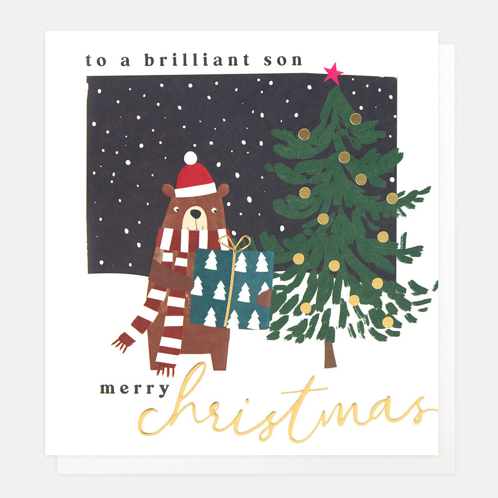 Christmas card featuring a bear wearing a hat and scarf in a snowy scene with tree & present and the words to a brilliant son merry Christmas