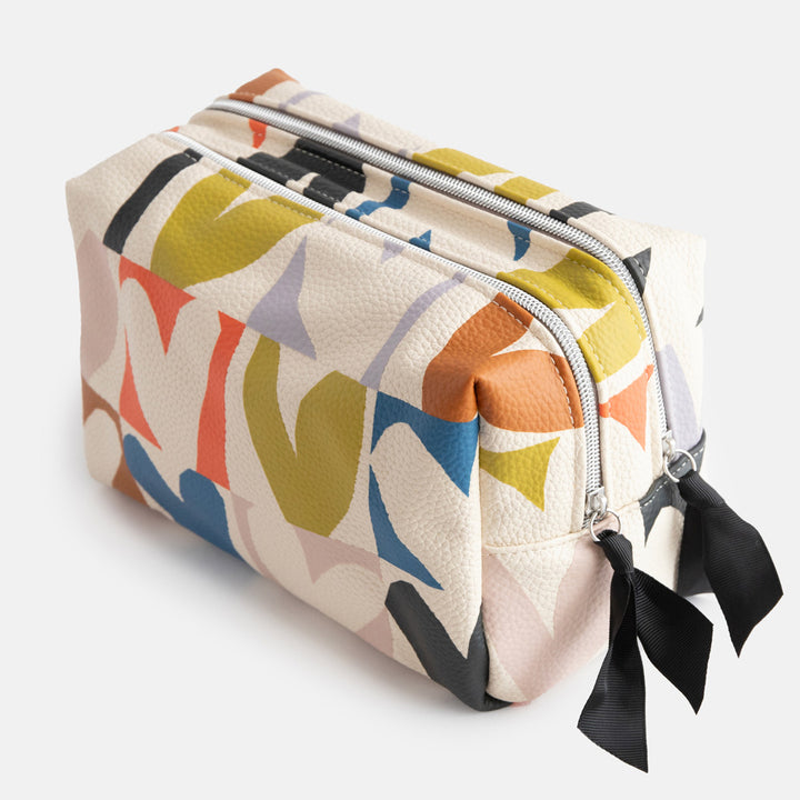 leather look PU large travel wash bag in multicoloured hearts design, with double silver zip opening, side grab handle, grey stripe print lining and black grosgrain zip pull