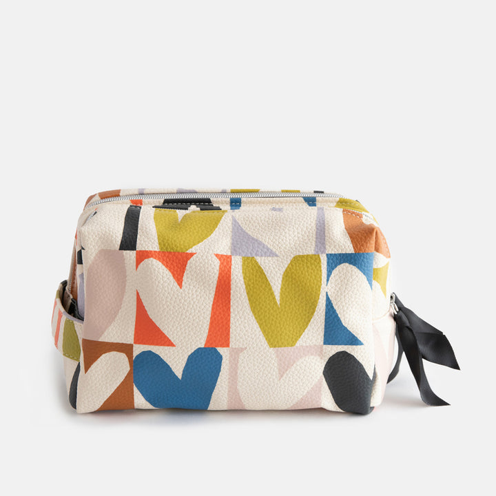 leather look PU large travel wash bag in multicoloured hearts design, with double silver zip opening, side grab handle, grey stripe print lining and black grosgrain zip pull