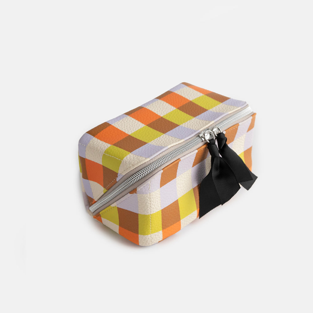 leather look PU lay flat cosmetics bag in warm tones check print with spotty wipe clean lining, silver zip and black grosgrain pull