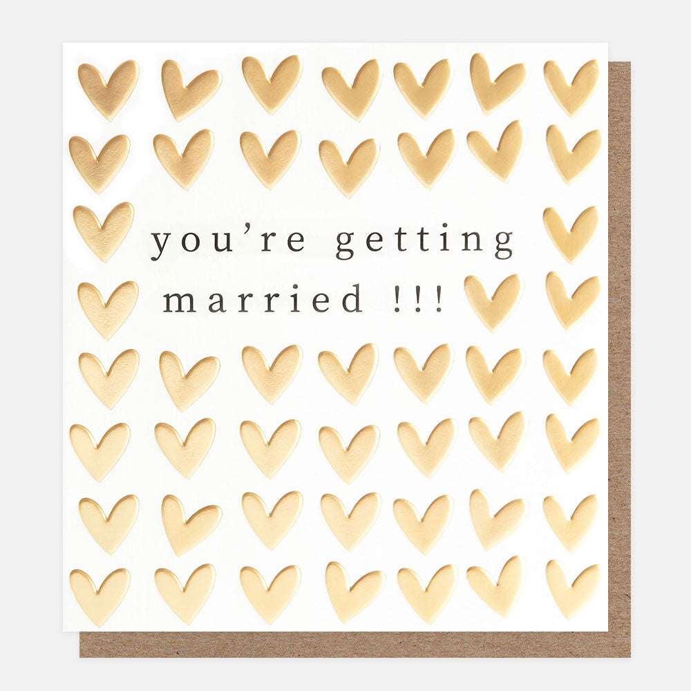 engagement card featuring gold hearts and the wording you're getting married