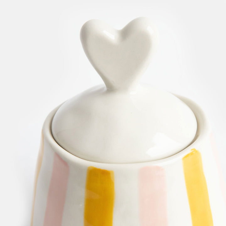 hand painted glazed ceramic stoneware sugar pot or trinket storage pot with a pink and mustard stripe design and heart shaped lid