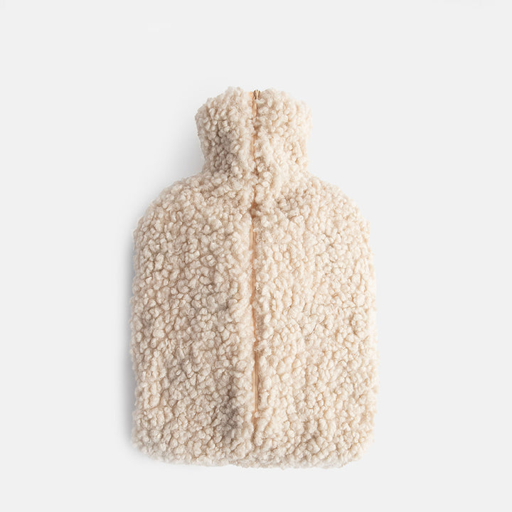 reverse of oatmeal borg hot water bottle with zip closure