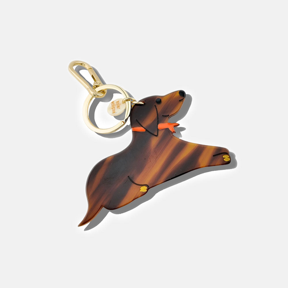 brown sausage dog with a red neckerchief bag charm or keyring