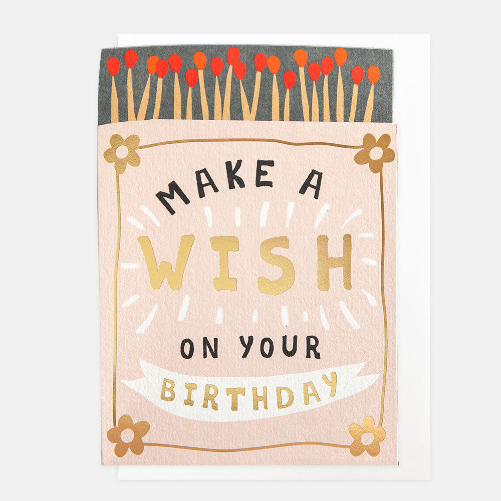 birthday card cut out in a matchbox shape featuring matches and 'make a wish on your birthday' message