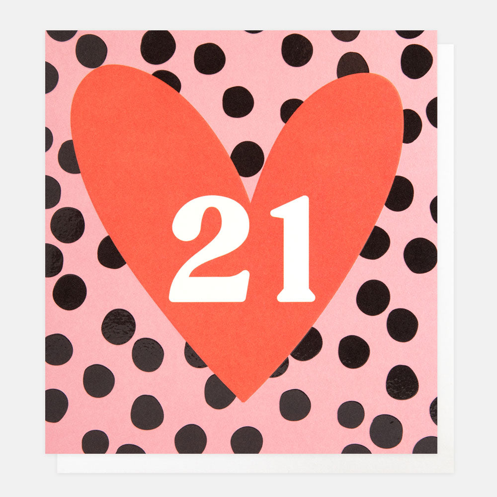21st birthday card with 21 in a red heart on a pink with black spots background