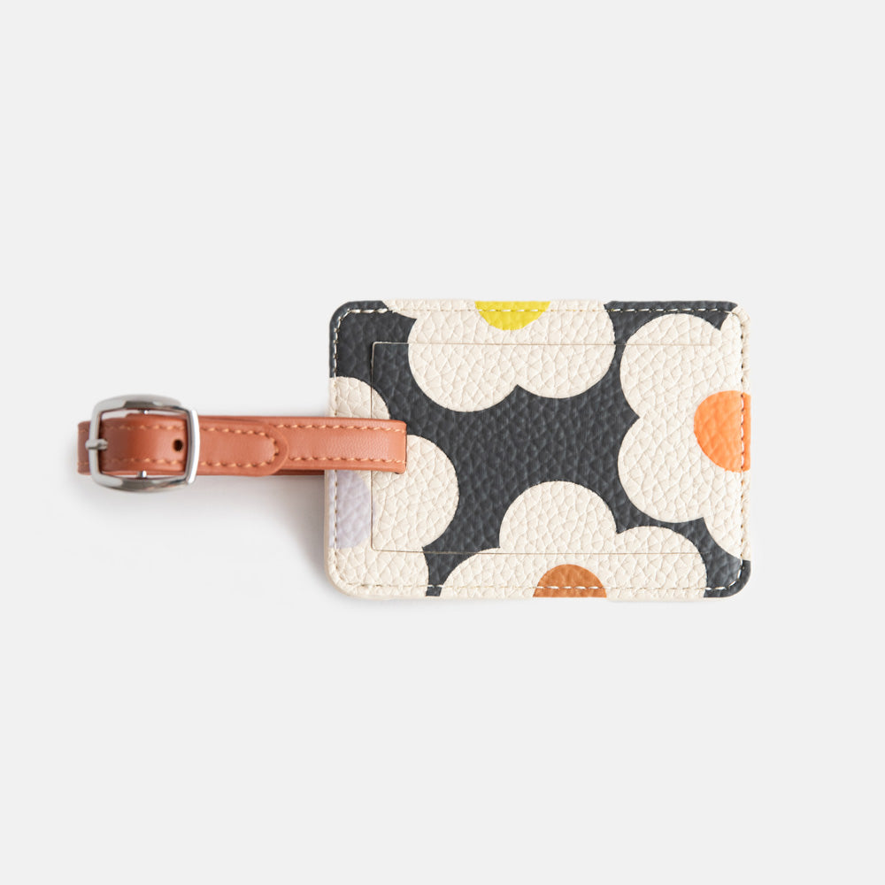 leather look PU luggage tag in multi flower charcoal print with tan buckled strap