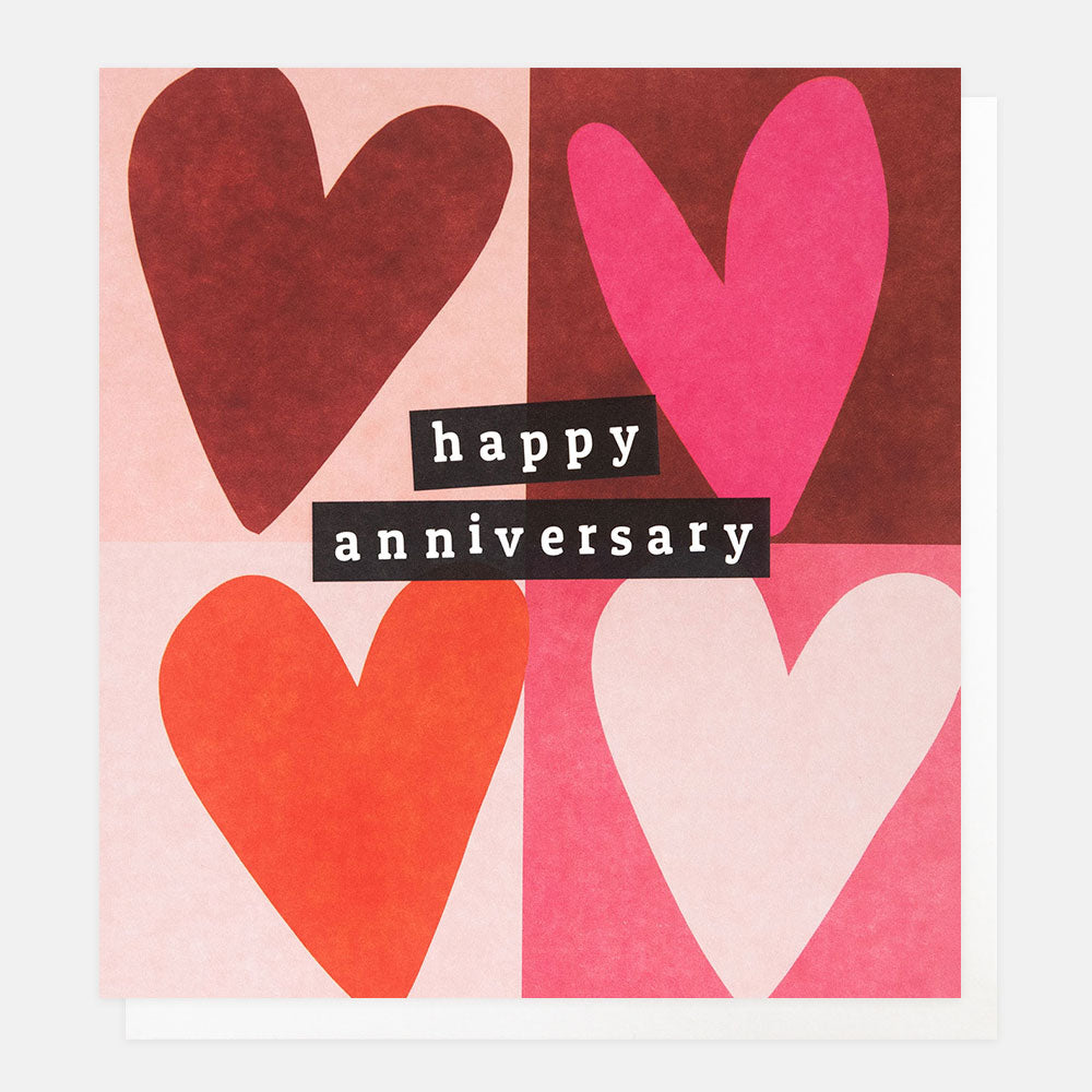 anniversary card featuring four pink & red hearts in a block grid design and the words happy anniversary