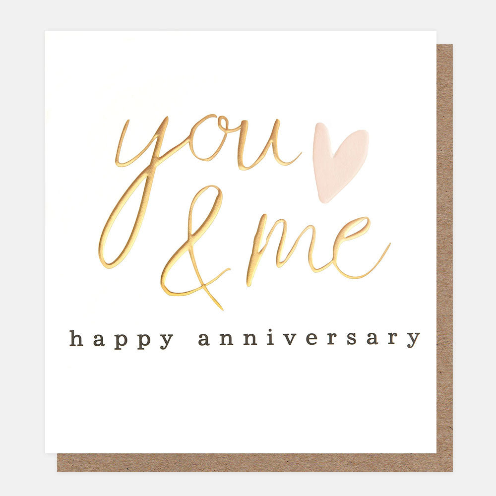 anniversary card featuring a pink hearts and gold wording you & me happy anniversary