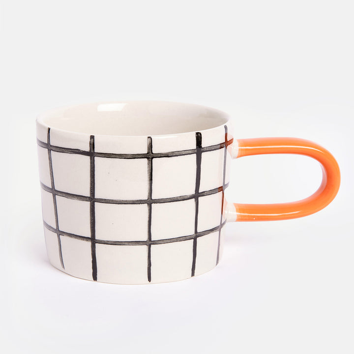 monochrome grid check stoneware ceramic mug with orange handle