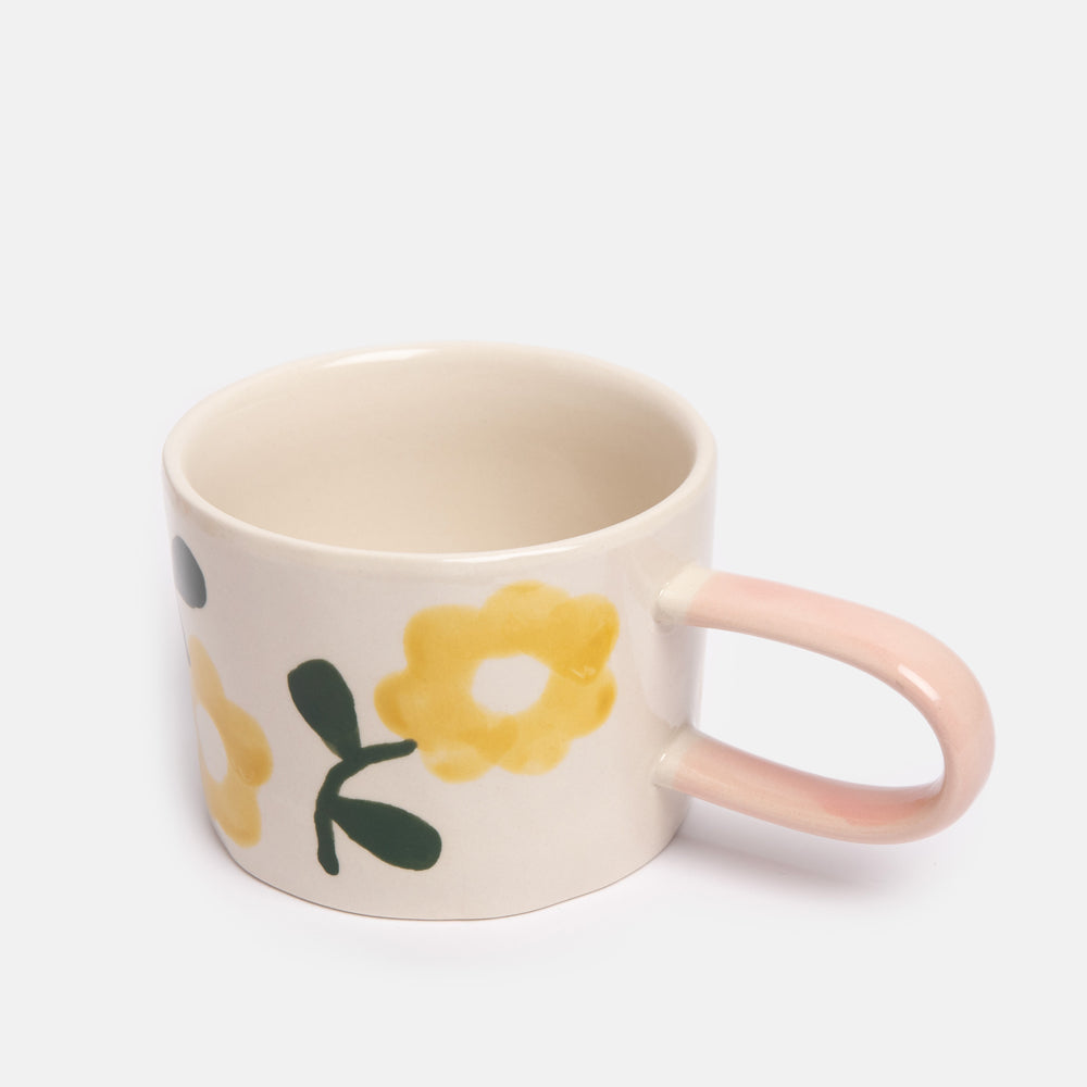 hand painted ceramic stoneware mug with yellow flowers design and pale pink elongated handle