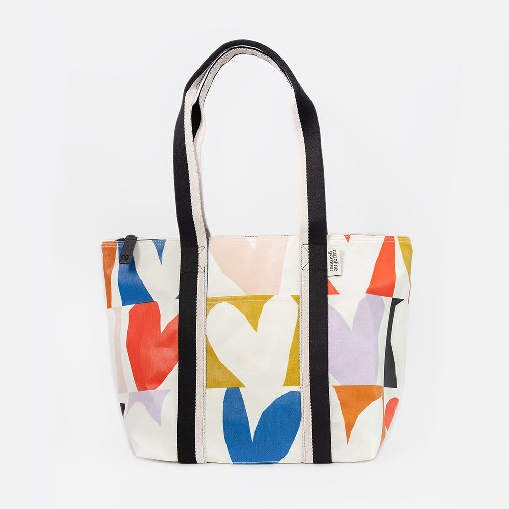 coated cotton canvas shopper style bag with bright colourful checked hearts design and black & white fabric handles