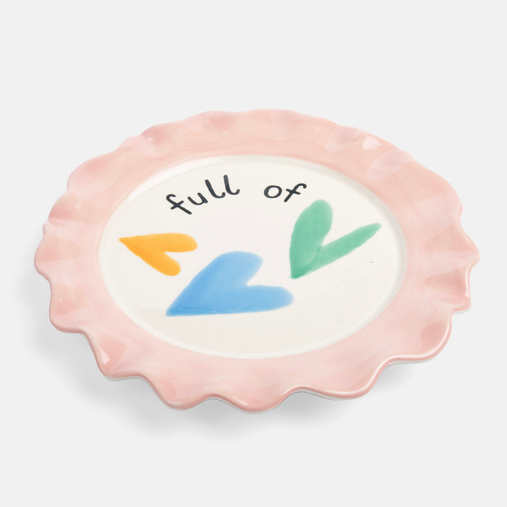 hand painted glazed stoneware plate with colourful hearts design and pale pink scalloped edge