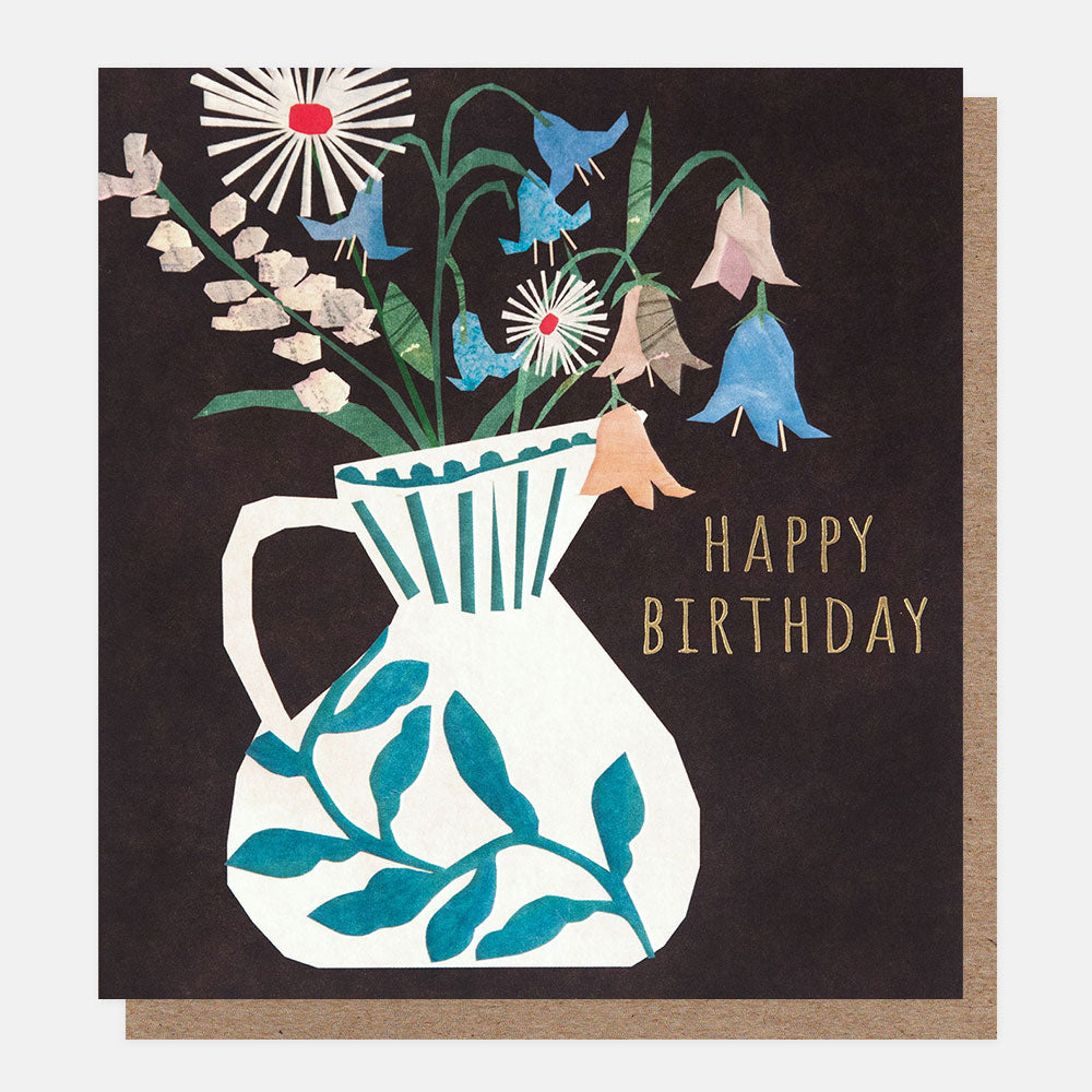 birthday card featuring a white vase with blue foliage design and blue, pink and white flowers