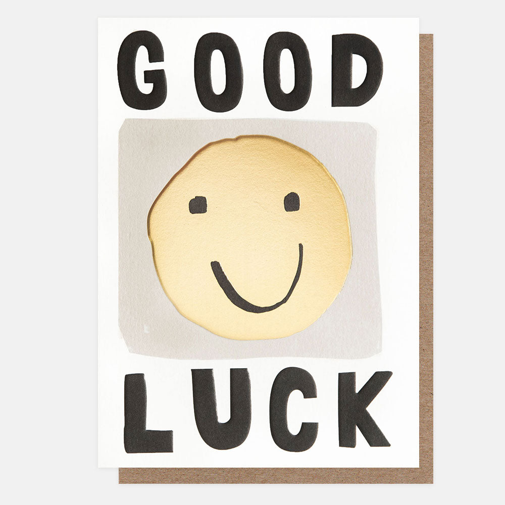 good luck card featuring yellow smiley face and bold black good luck text