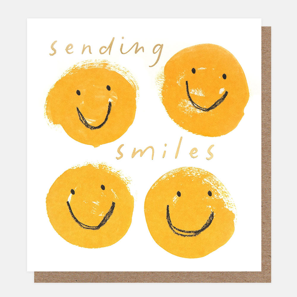 Card with yellow smiley faces and text 'Sending smiles' on a white background