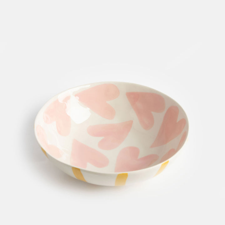 hand painted ceramic stoneware bowl with mustard stripes outer and pink hearts design inside