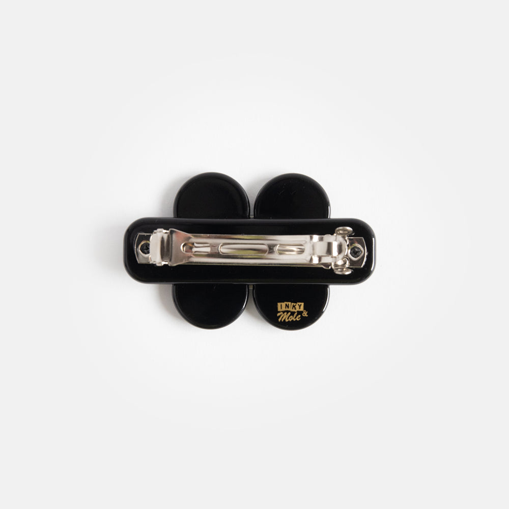 mini hair clip in black with black and cream flower design