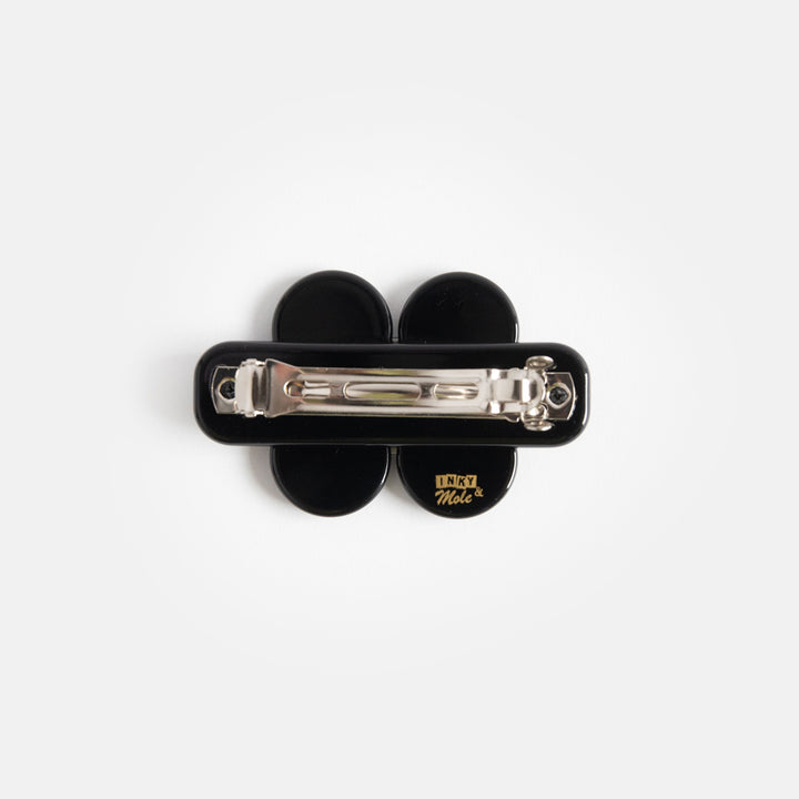 mini hair clip in black with black and cream flower design