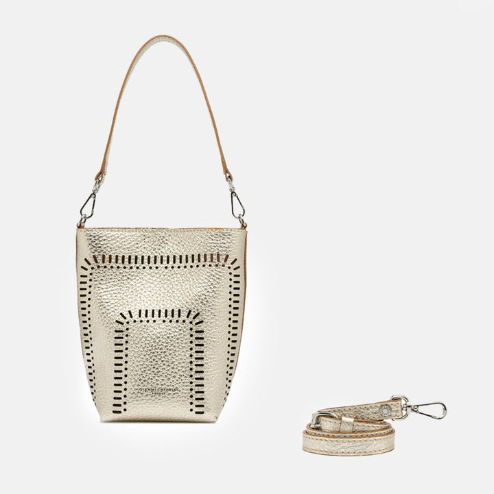 gold leather bucket tote bag with cut out design and separate crossbody and shoulder straps
