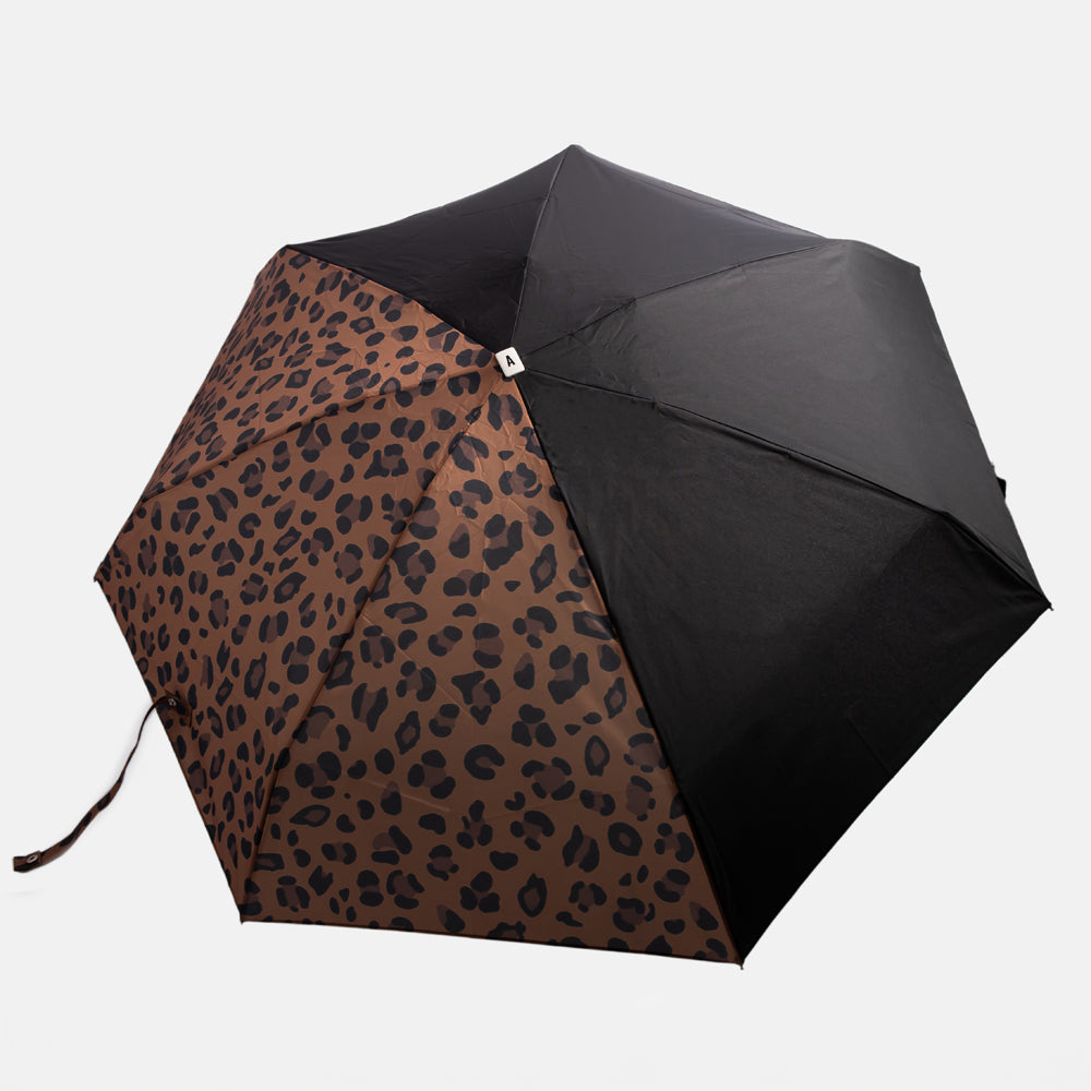 half leopard print half black folding compact umbrella with wooden handle and a monochrome strap