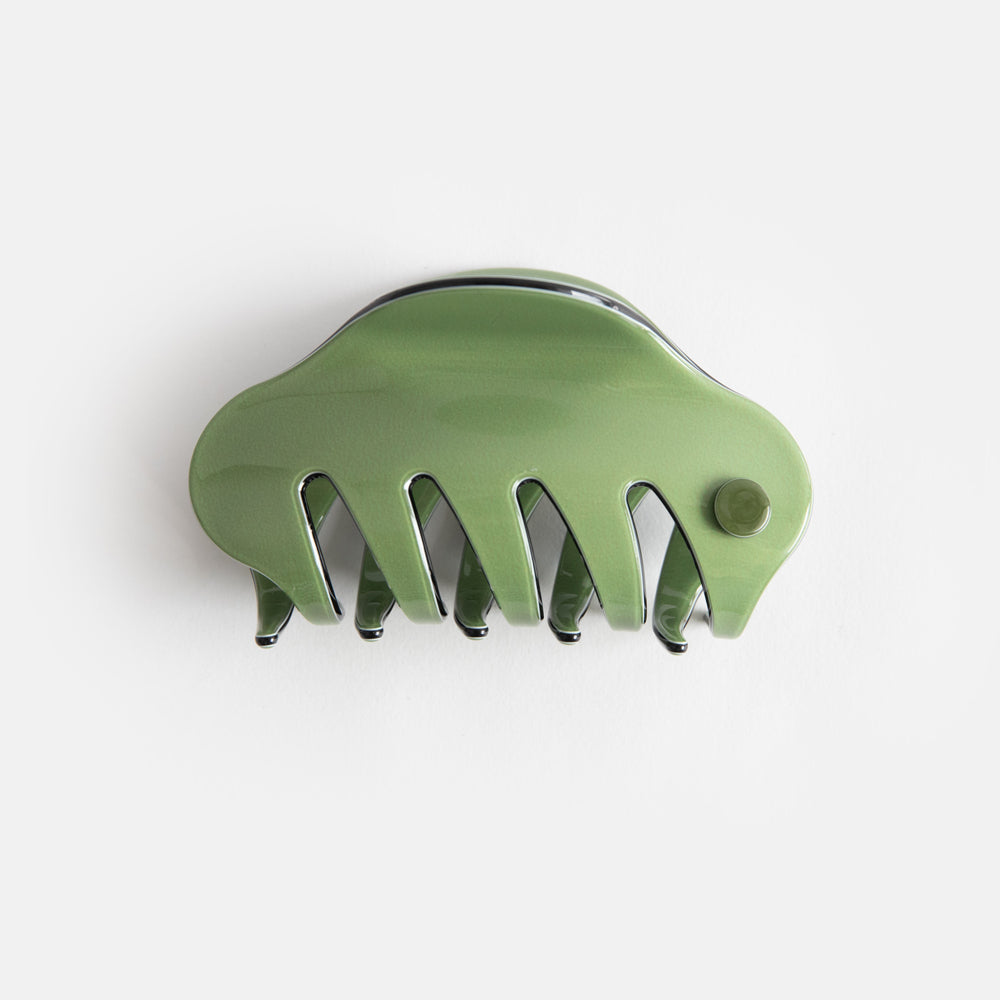 green with black trim hair claw with cutaway teeth