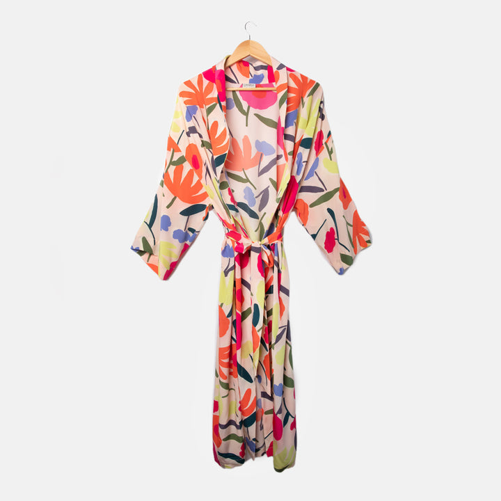 colourful abstract floral print silk dressing gown on a pale pink base