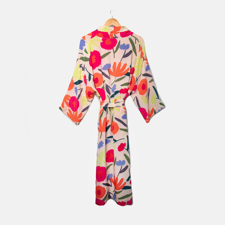 colourful abstract floral print silk dressing gown on a pale pink base