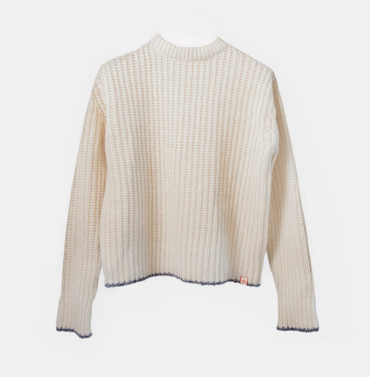 cream sweater on a light grey background
