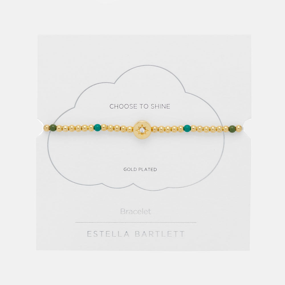 gold plated and green enamel bead bracelet with gold coin charm featuring a cubic zirconia star