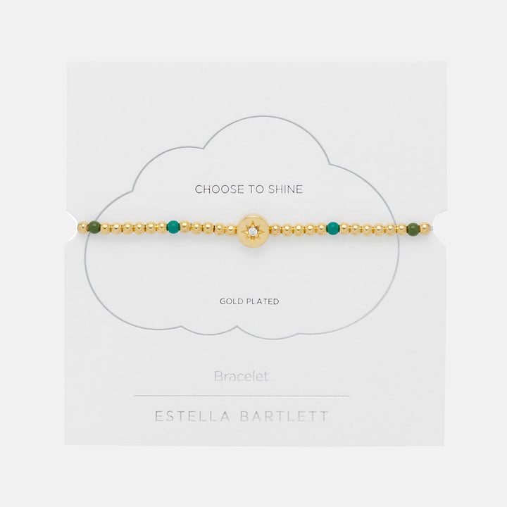gold plated and green enamel bead bracelet with gold coin charm featuring a cubic zirconia star