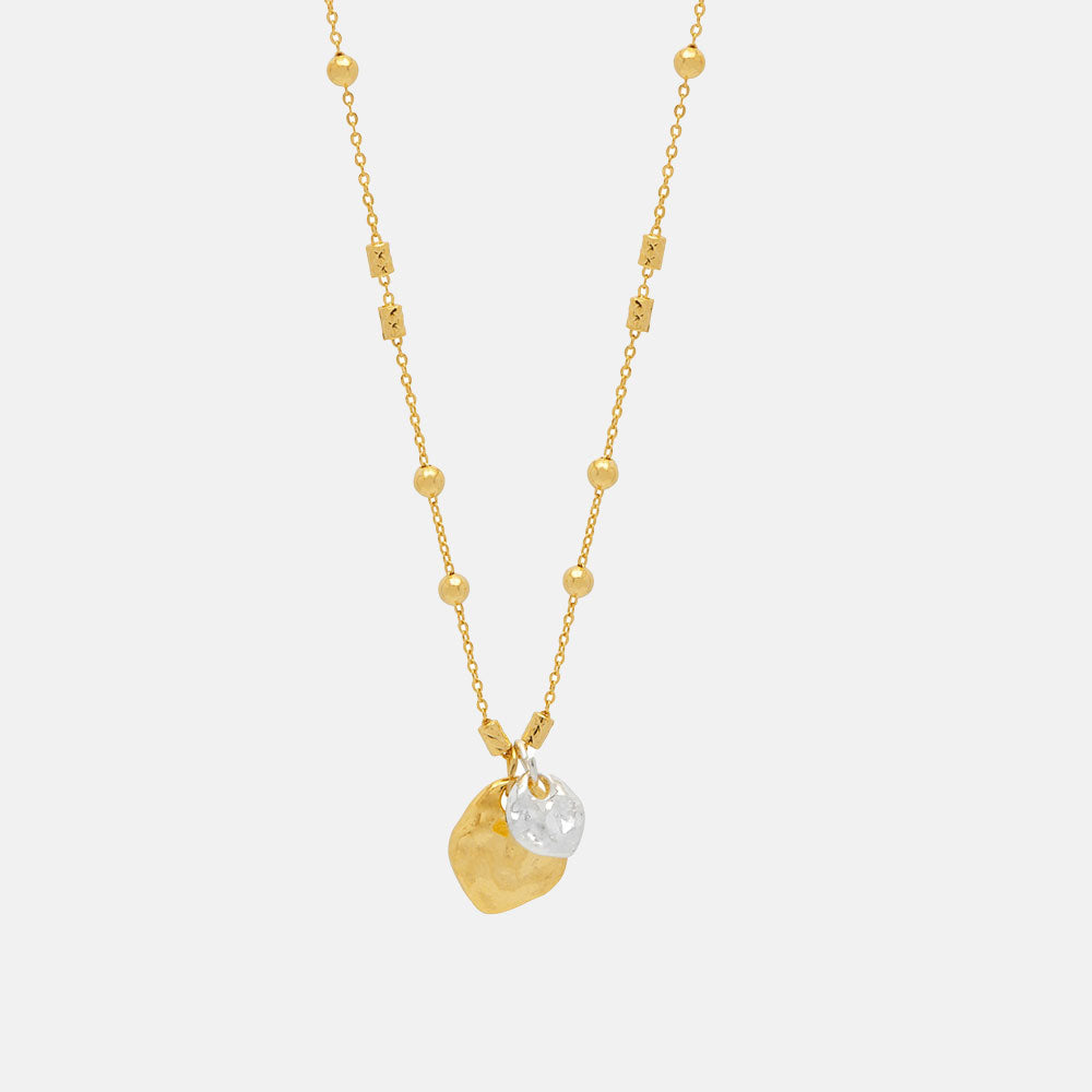 fine gold chain & bead necklace with two hammered pebble charms, one larger gold pebble and one smaller silver pebble