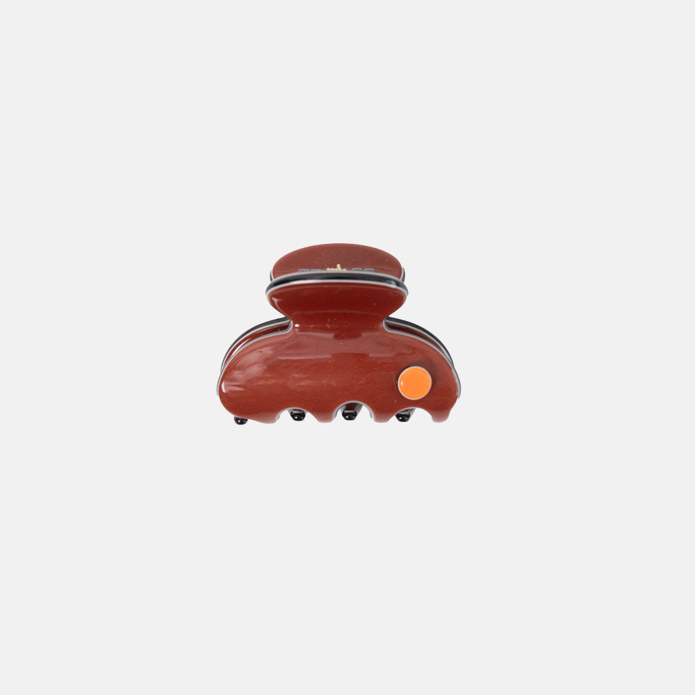 Brown hair clip on a white background
