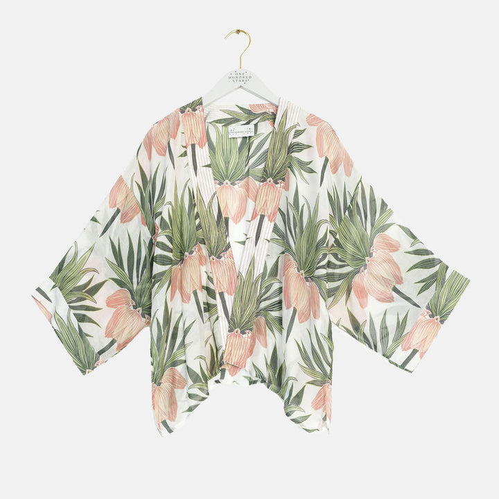 women's short kimono featuring a print of orange crown imperial flowers and green leaves on an ivory base