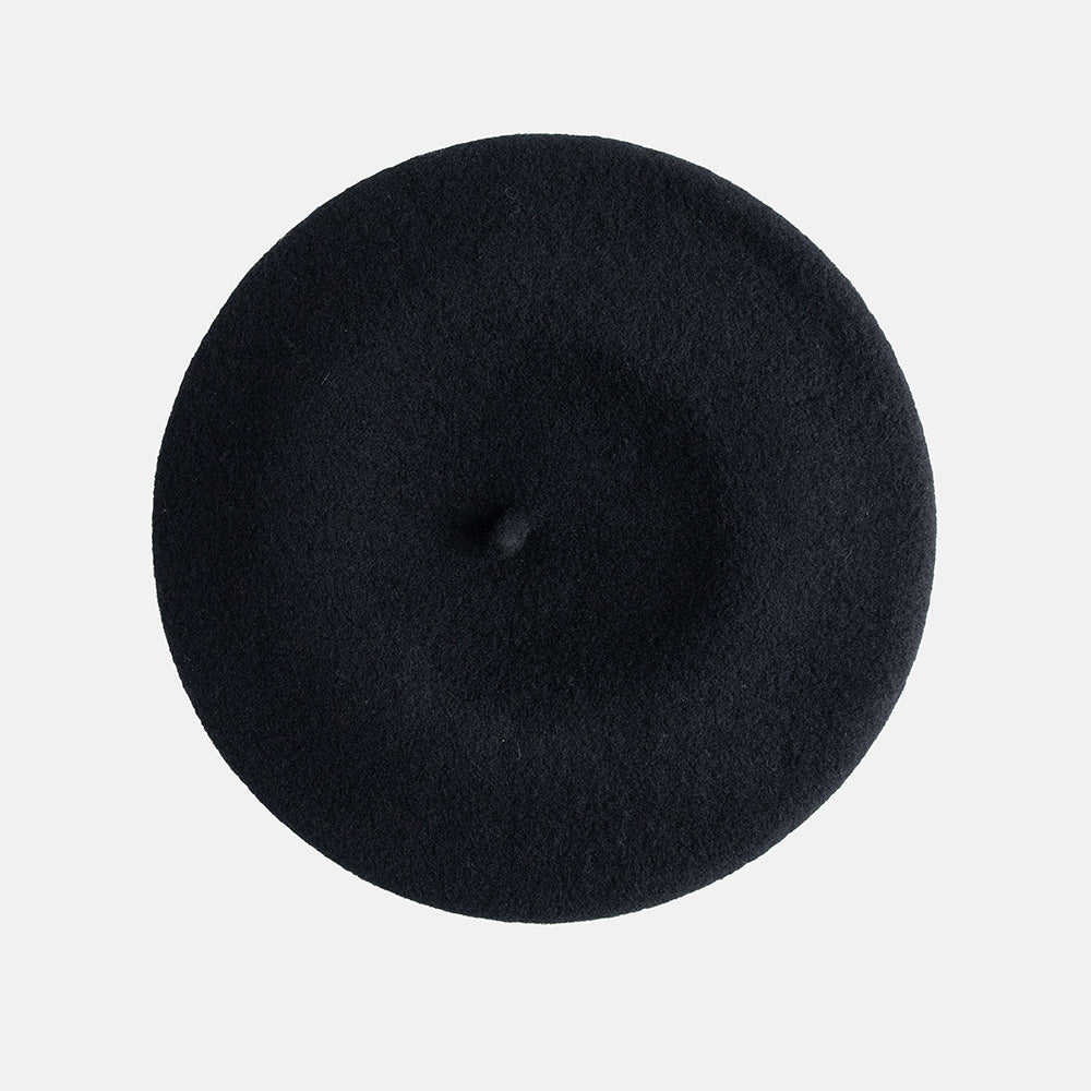 Black beret on a light gray background