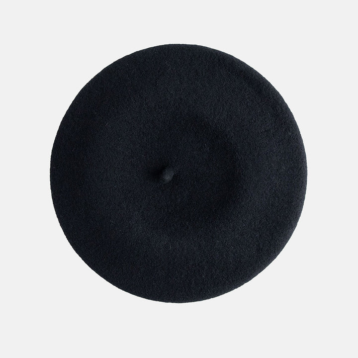 Black beret on a light gray background