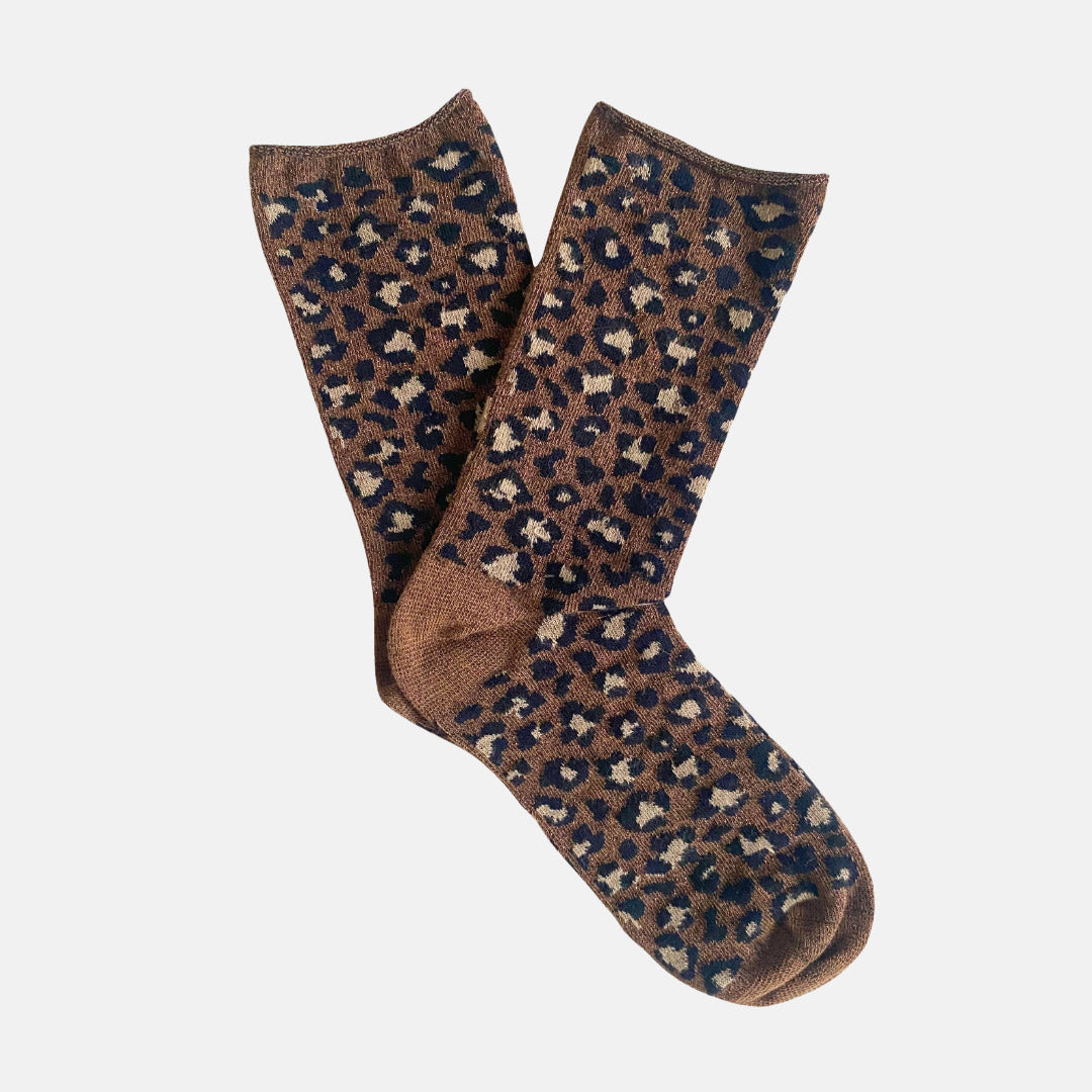 Pair of brown leopard print sparkly socks on a light grey background