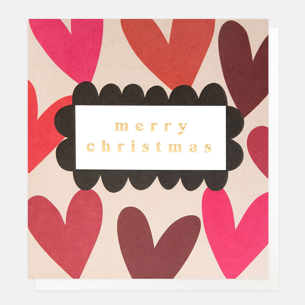 Christmas card with red and pink hearts and 'merry christmas' text.